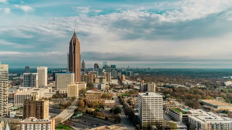 Atlanta skyline with Nash Facility Solutions service vehicles